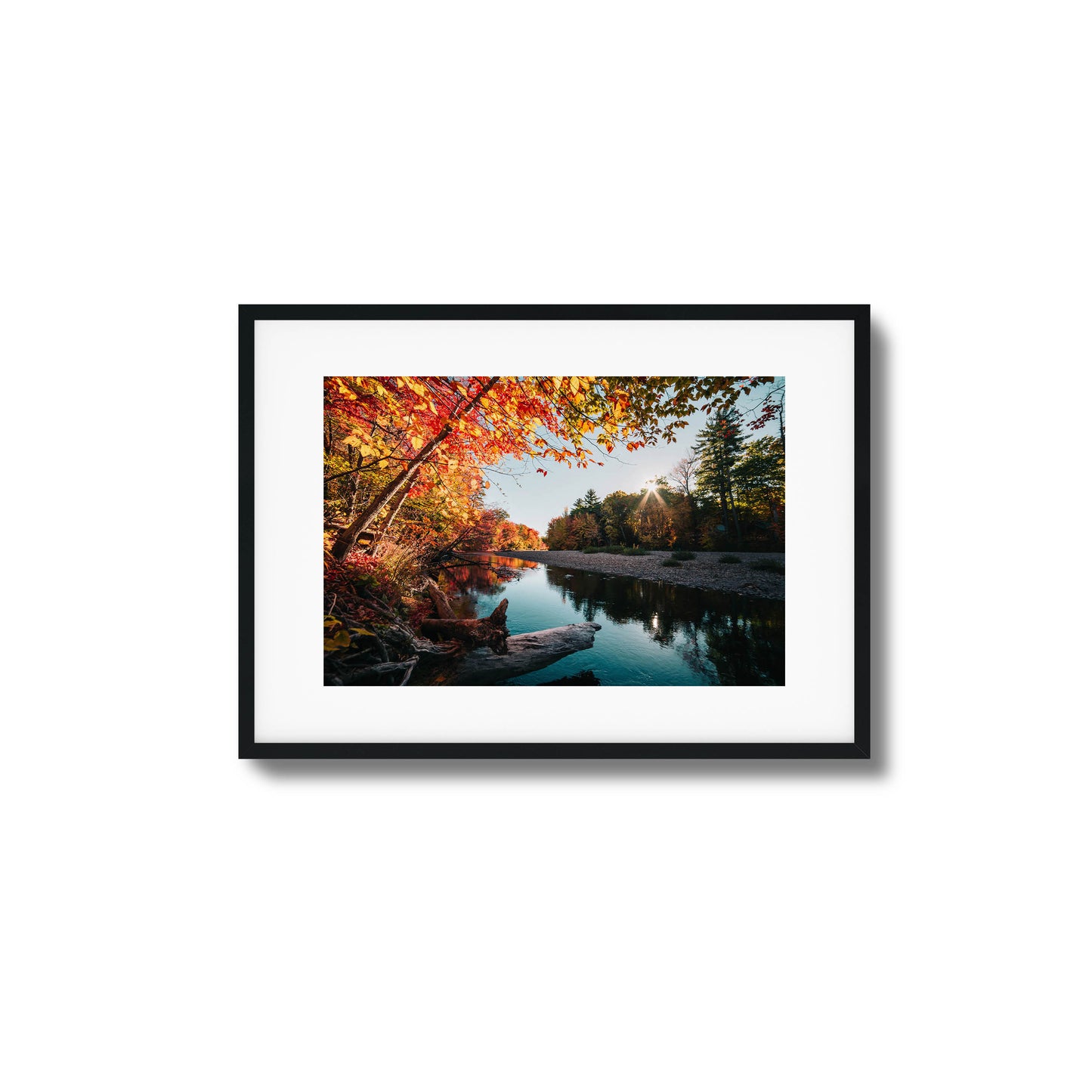 Autumn river with vibrant foliage and sunlight filtering through trees