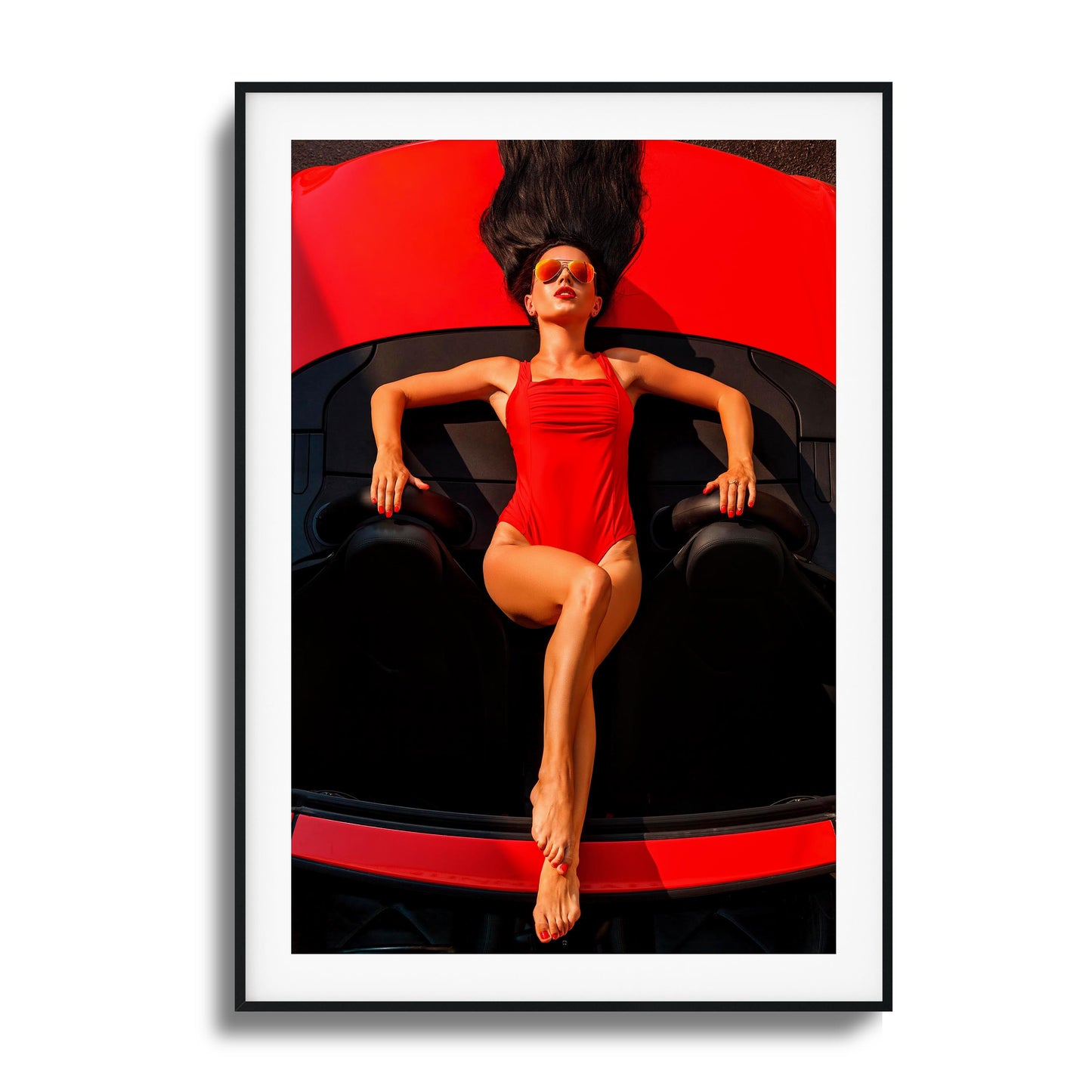 Woman in red swimsuit reclining on a red car framed art