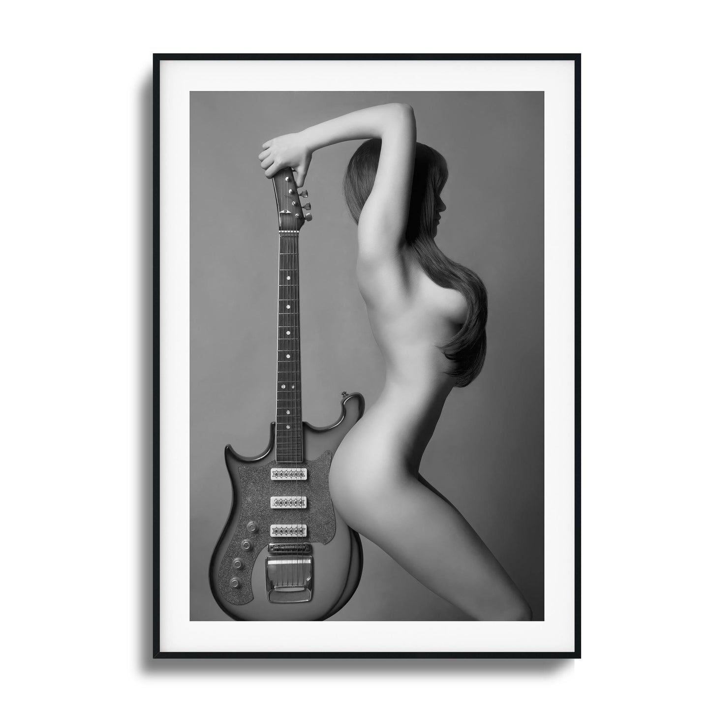 Artistic black-and-white image of a figure with a guitar