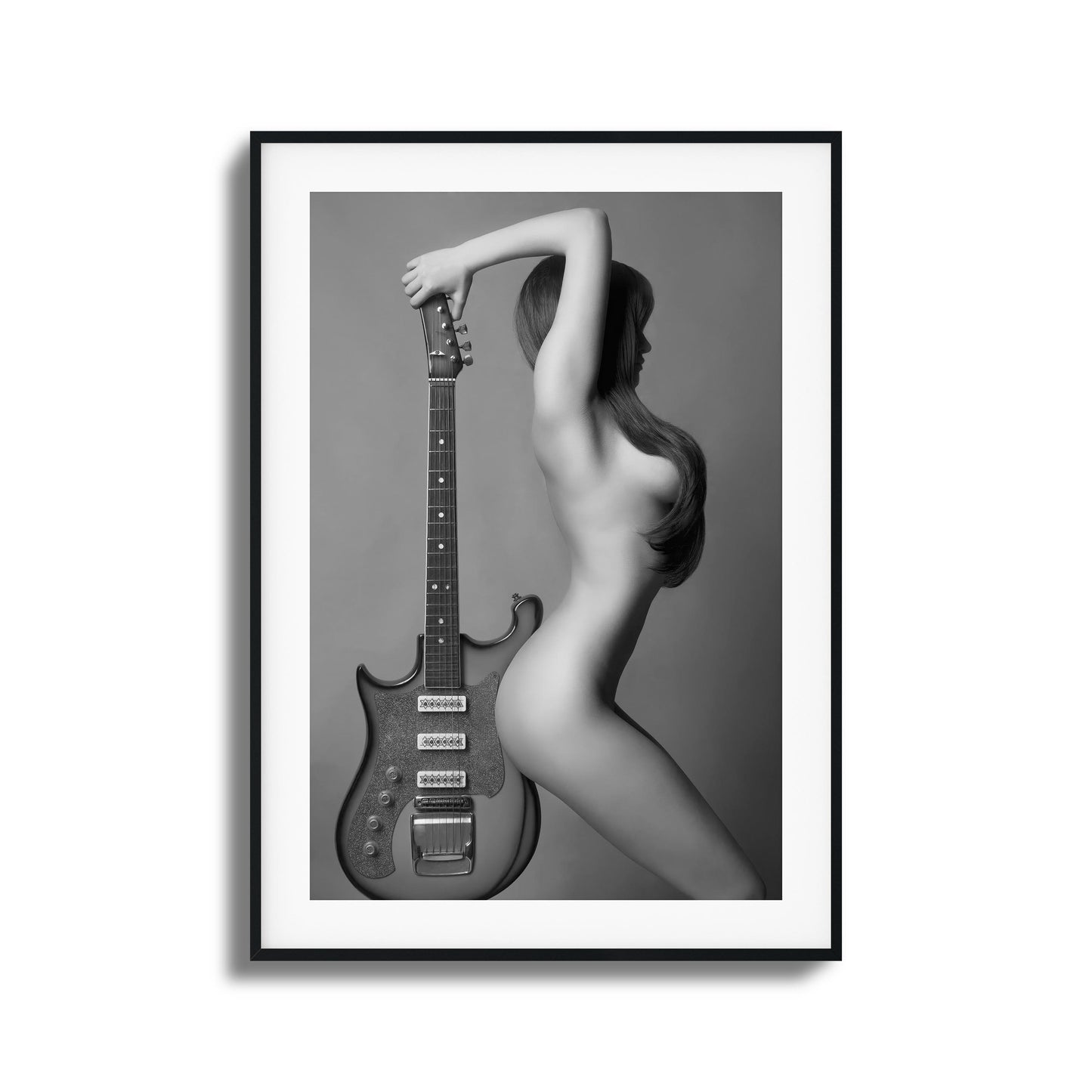 Artistic black-and-white image of a figure with a guitar