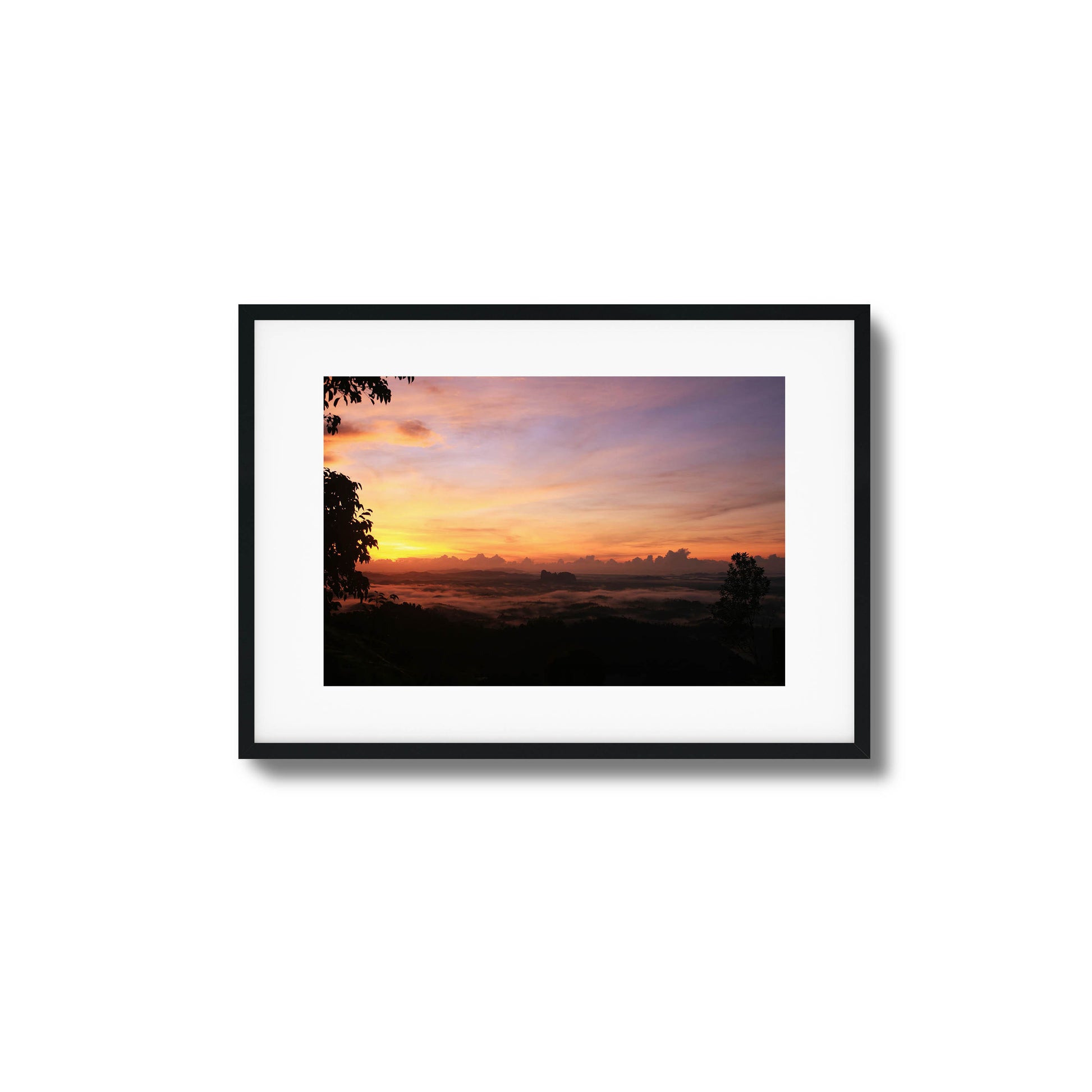 Cloud-covered valley illuminated by soft pastel hues of dawn, perfect for serene framed wall art.