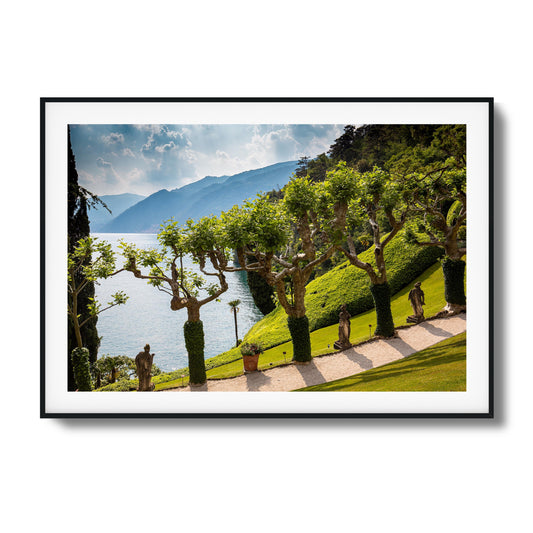 Coastal Garden View Over Lake Framed Art - Assure Spark