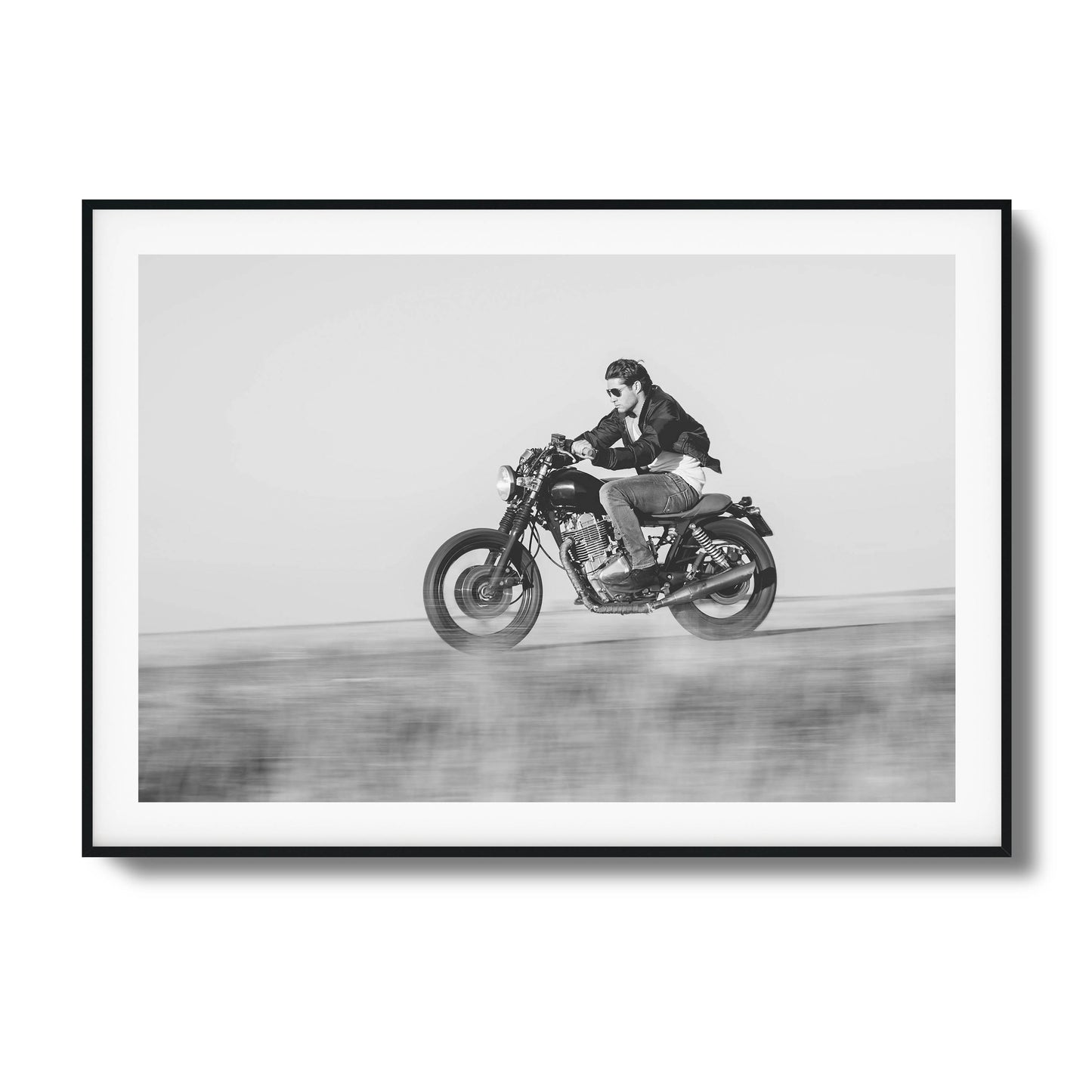 Black-and-white motorcyclist in motion framed art