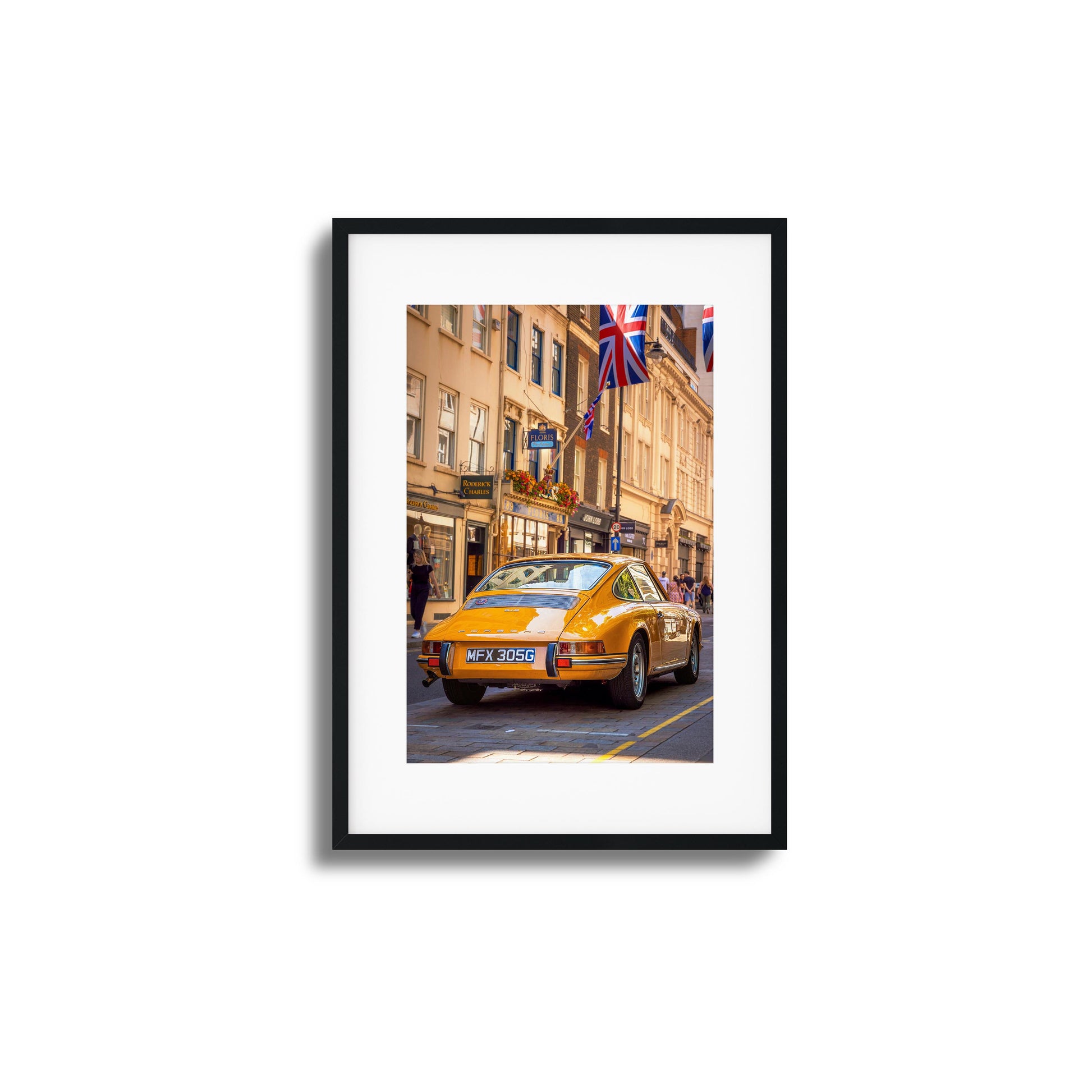 A vintage Porsche in vibrant city surroundings, ideal as framed artwork for a classic touch.