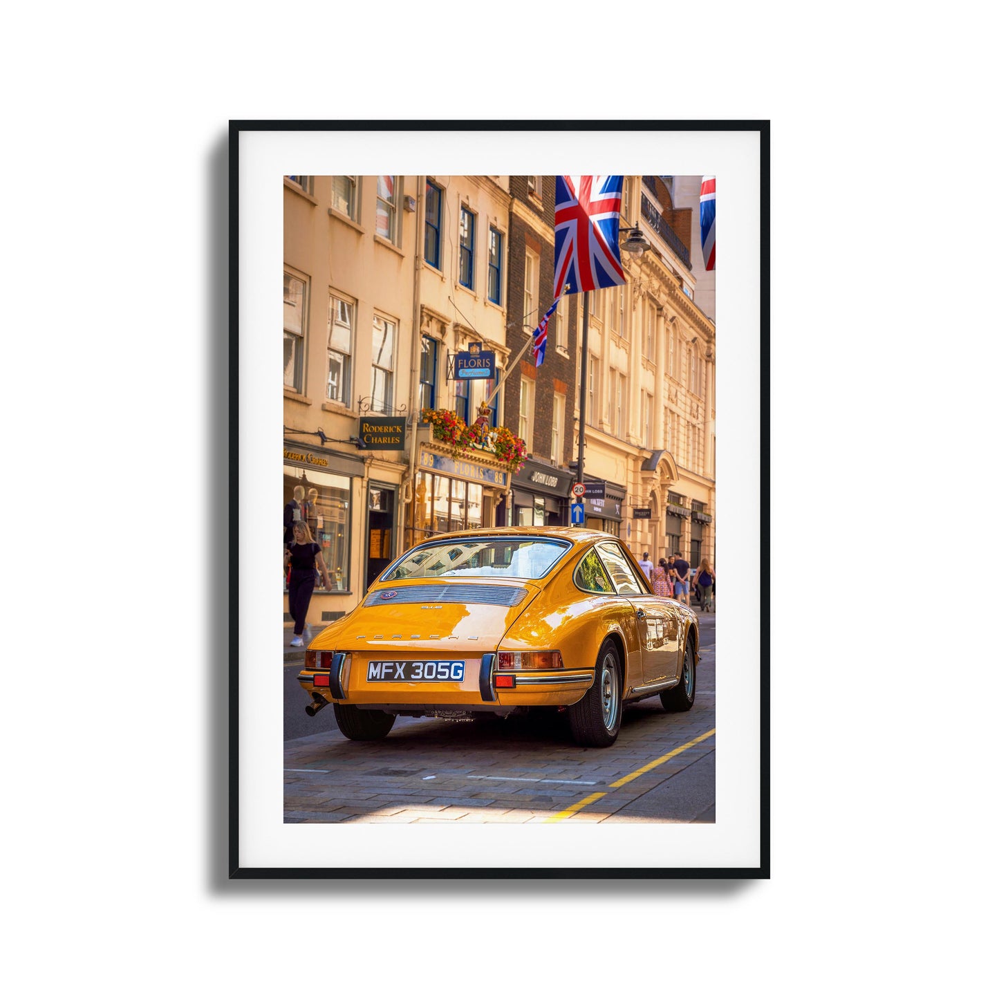 A vintage Porsche in vibrant city surroundings, ideal as framed artwork for a classic touch.