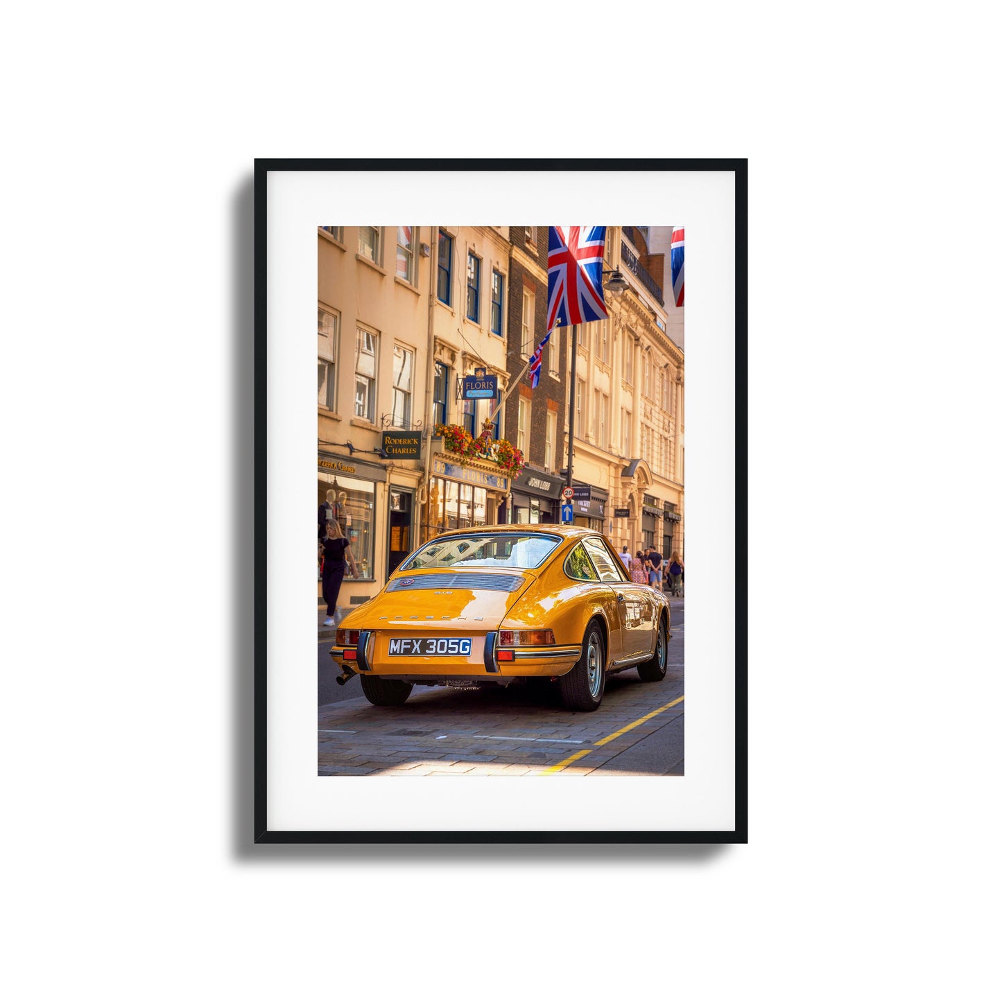 A vintage Porsche in vibrant city surroundings, ideal as framed artwork for a classic touch.