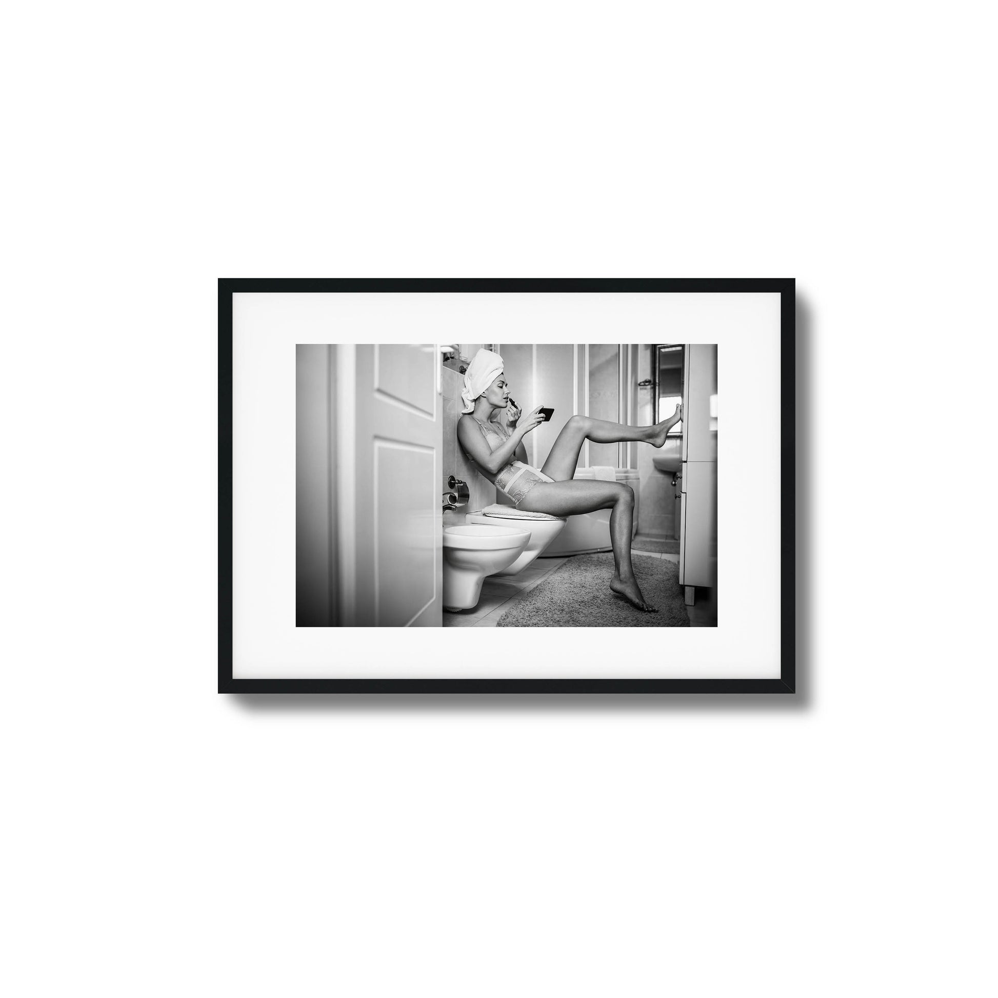 Black-and-white woman applying makeup in bathroom framed art