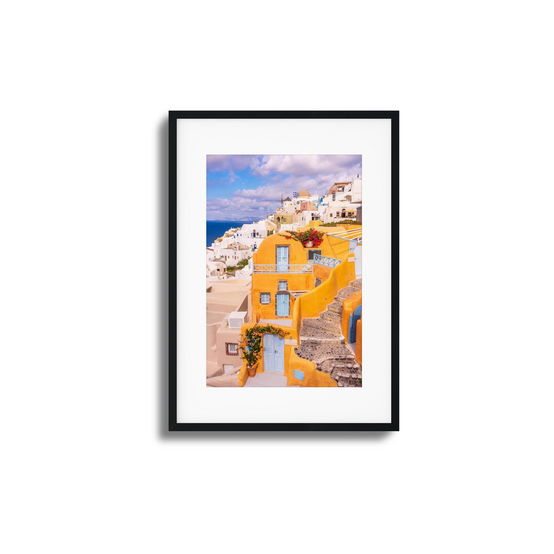 Yellow and white architecture of Santorini with ocean views, perfect for adding Mediterranean charm.