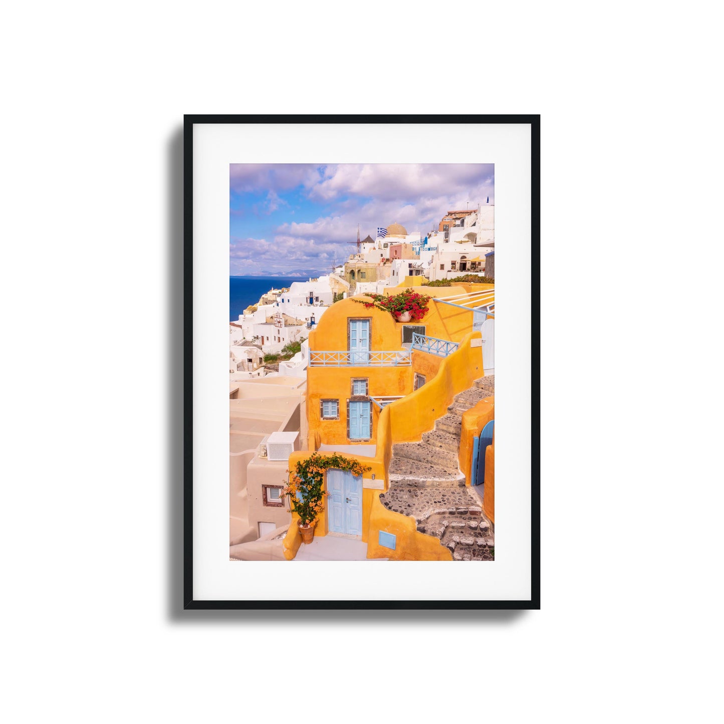 Yellow and white architecture of Santorini with ocean views, perfect for adding Mediterranean charm.