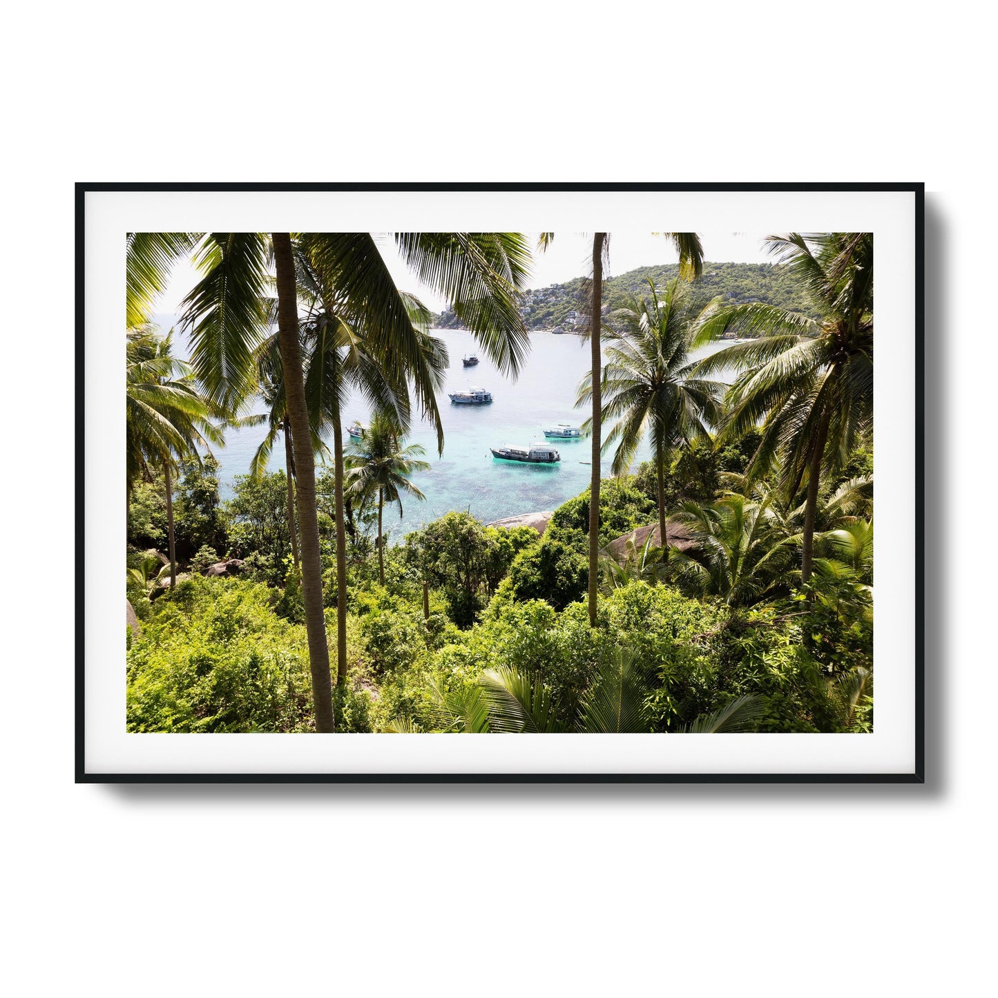 Tropical scene with palm trees and boats in clear water framed art