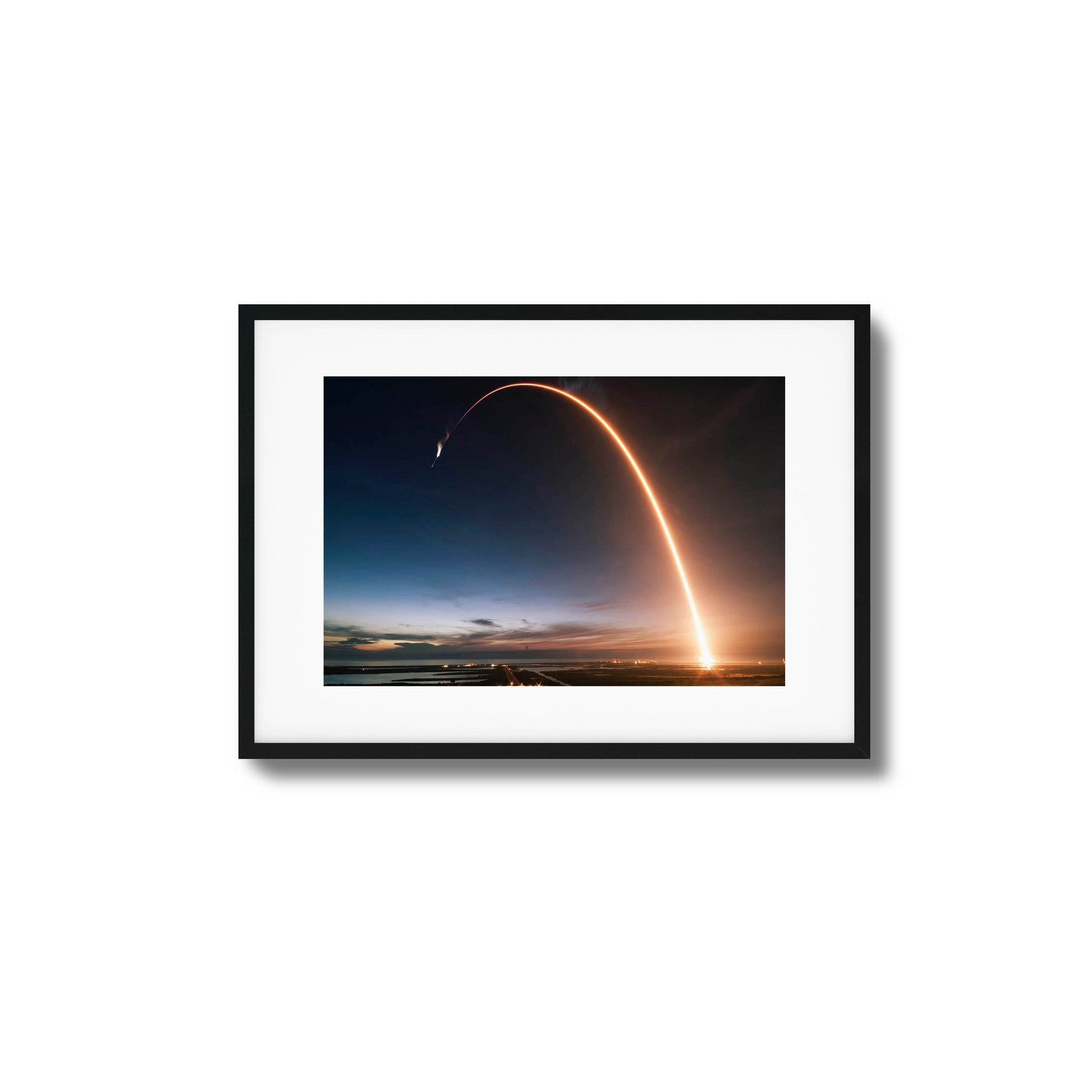 Long-exposure image of a rocket launch at twilight