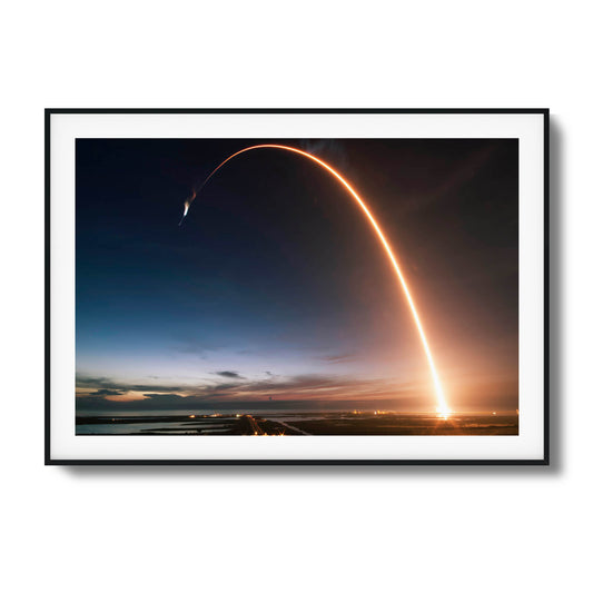 Long-exposure image of a rocket launch at twilight