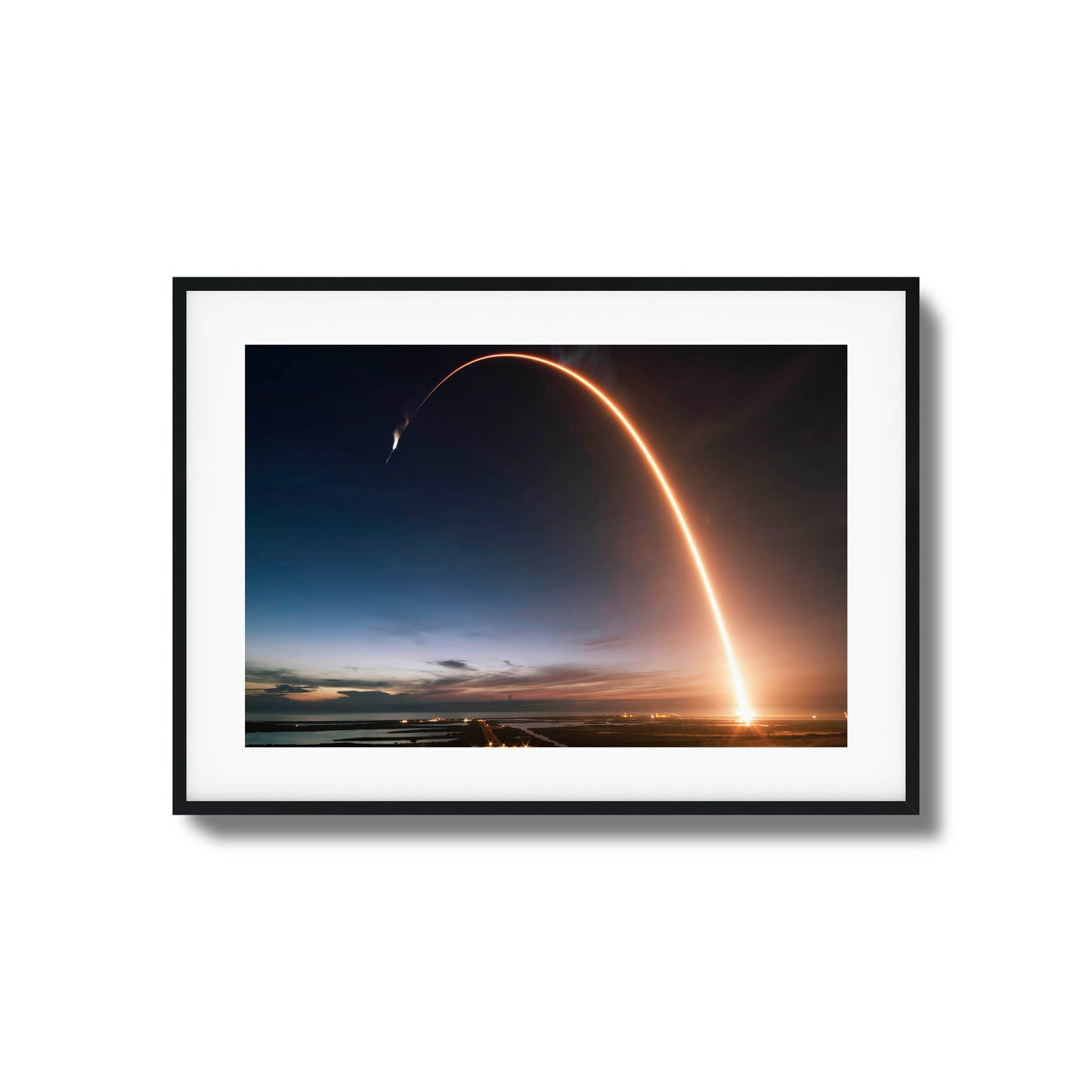 Long-exposure image of a rocket launch at twilight