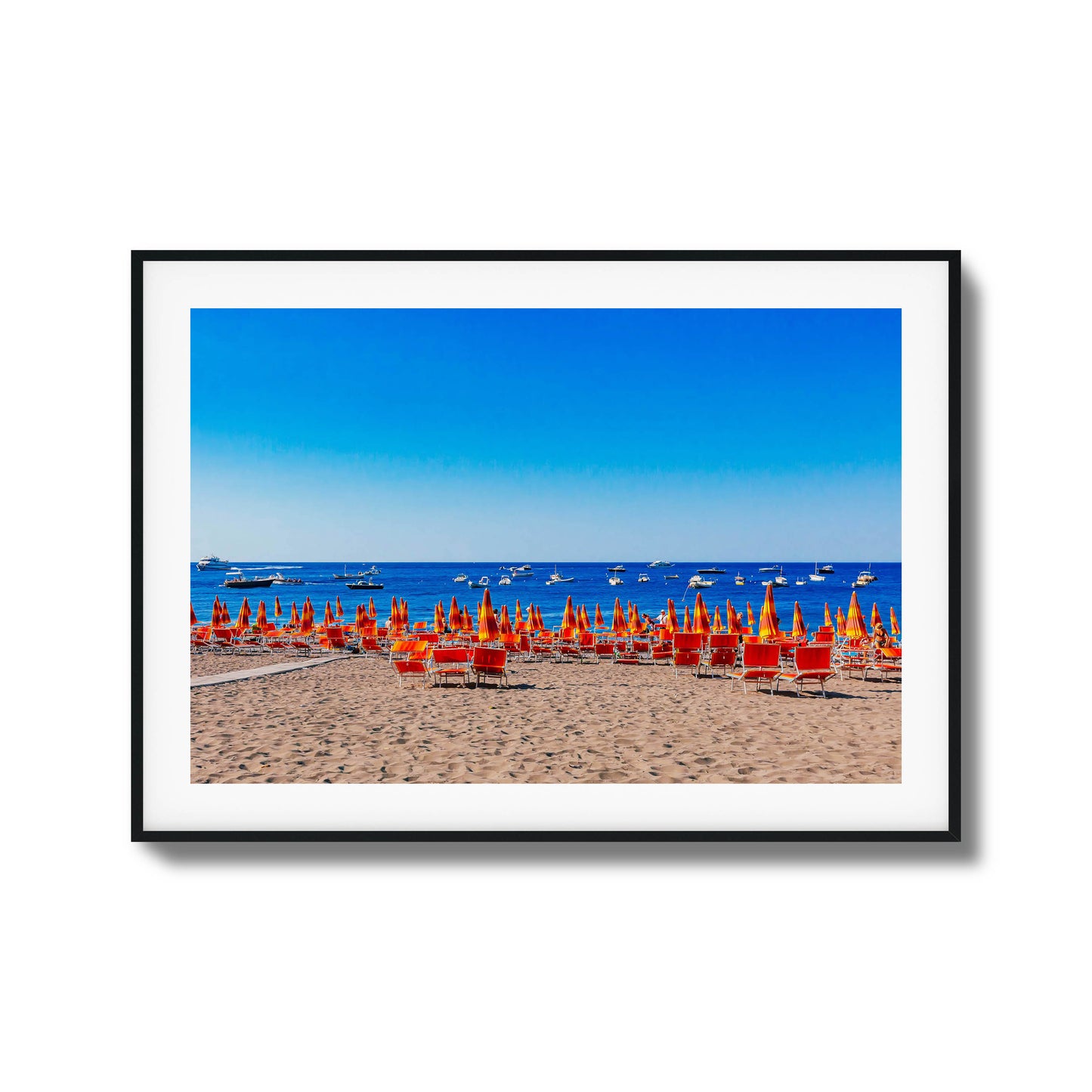 Colorful beach with orange umbrellas and blue ocean framed art