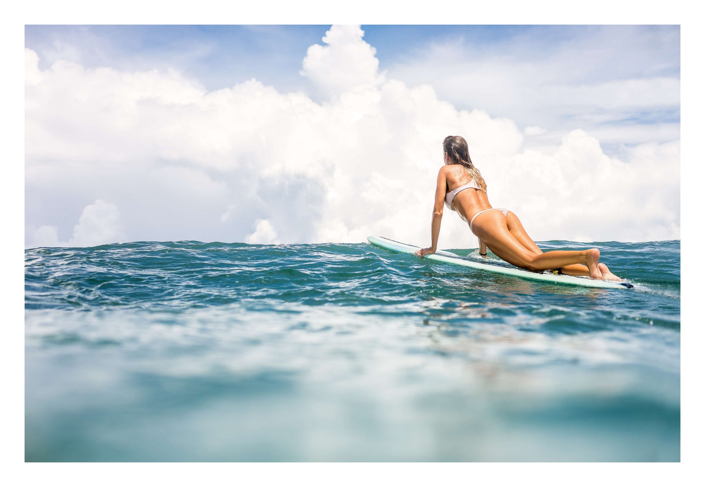Woman Surfing on Blue Ocean Framed Art